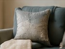 Upholstered chair and pillow